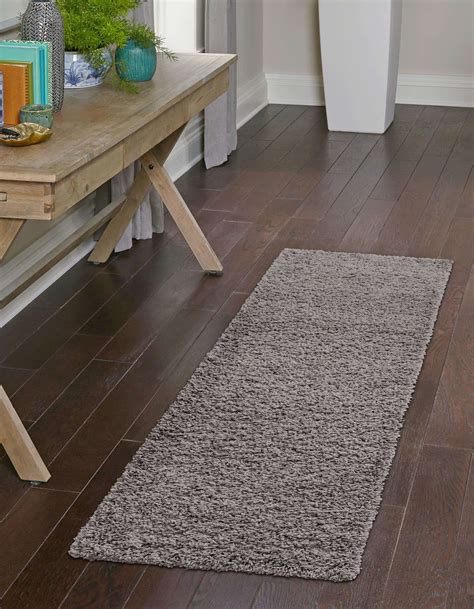 Features. Cut and packed in USA, slip-resistant rubber back, colorfast, mold and mildew resistant, stain-resistant. Low pile height for easy vacuum and cleaning, thin design fit under doors, perfect for high traffic areas. Solid color tracker utility runner rug by customizing for your choice of length. Due to the difference in monitor colors ...